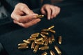 Woman sitting at a table with ammunition Royalty Free Stock Photo