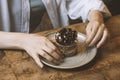 woman sitting at table with served chocolate dessert