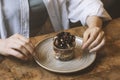 woman sitting at table with served chocolate dessert