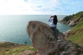 Woman sitting and take photo