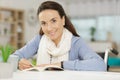 Woman sitting in wheelchair disability concept reading book Royalty Free Stock Photo