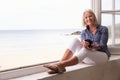 Woman Sitting At Window And Looking At Beautiful Beach View Royalty Free Stock Photo