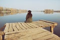 Woman Sitting at Wooden Mole