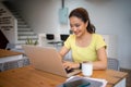 Woman sitting working with laptop at coffee shop, freelance woman working outside Concept Royalty Free Stock Photo