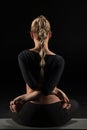 Woman sitting in yoga position