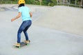 Woman skateboarders riding on a skateboard