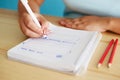 Woman sketching web design in office