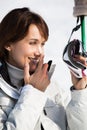 Woman on the ski slopes applying a protective cream