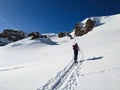 A woman on a ski tour towards Erdisgulmen in the Flumserberg. Ski climbing in beautiful Switzerland. High quality photo