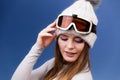 Skier girl wearing warm clothes ski googles portrait.