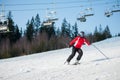 Woman skier with ski at winer resort in sunny day Royalty Free Stock Photo