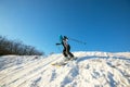 Woman skier skiing downhill in the winter forest Royalty Free Stock Photo