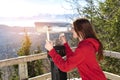 woman,skier,traveler looking Stationary Binocular on observation deck on snow mountains viewpoint Royalty Free Stock Photo