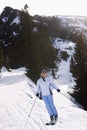 Woman Skiing Down Slope