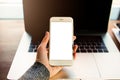 Woman skilled freelance worker holding mobile phone with empty mock up copy space screen