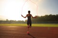 Woman skipping rope during sunny morning Royalty Free Stock Photo