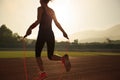 Woman skipping rope during sunny morning Royalty Free Stock Photo