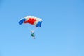 Woman - skydiver against cloudless blue sky Royalty Free Stock Photo