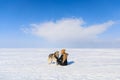 Woman with sled dog on the frozen bay Royalty Free Stock Photo