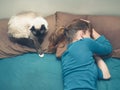 Woman sleeping in bed with cat Royalty Free Stock Photo