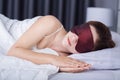 Woman sleeping on bed with eye mask Royalty Free Stock Photo