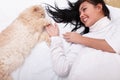 Woman sleeping on the bed with her cat Royalty Free Stock Photo