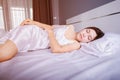 Woman sleeping on bed with soft light Royalty Free Stock Photo