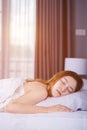 Woman sleeping on bed with soft light Royalty Free Stock Photo