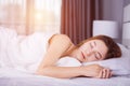 Woman sleeping on bed with soft light Royalty Free Stock Photo