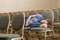 Woman sleeping at boring conference Royalty Free Stock Photo