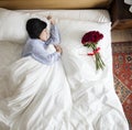 Woman sleeping and a bouquet of flower romance concept