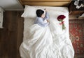 Woman sleeping and a bouquet of flower romance concept