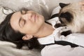 Woman sleeping with cat Royalty Free Stock Photo