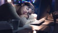 Woman sleeping on the desk at night Royalty Free Stock Photo