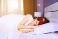 woman sleeping with eye mask on bed Royalty Free Stock Photo