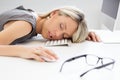 Woman sleeping in front of computer