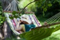 Woman sleeping on a hammock