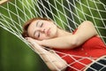 Woman sleeping on hammock in a garden or forest Royalty Free Stock Photo