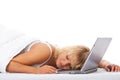 Woman sleeping on her laptop in bed Royalty Free Stock Photo