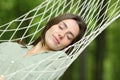 Woman sleeping lying on hammock in a forest Royalty Free Stock Photo