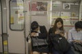 Woman Sleeping At An Osaka Subway Train Japan