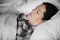 A woman sleeping soundly on bed Royalty Free Stock Photo