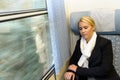 Woman sleeping in train compartment tired resting Royalty Free Stock Photo