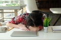 Woman sleeping at workplace. girl tired from hard work