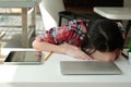 Woman sleeping at workplace. girl tired from hard work