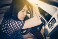 Woman sleepy tired and have a headache while driving car Royalty Free Stock Photo