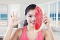 Woman with slice of watermelon and OK sign Royalty Free Stock Photo