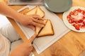 the woman sliced the cooked bread slices into triangles