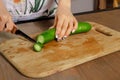 Woman sliced cucumber