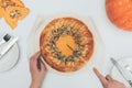 Woman slicing pumkin pie Royalty Free Stock Photo